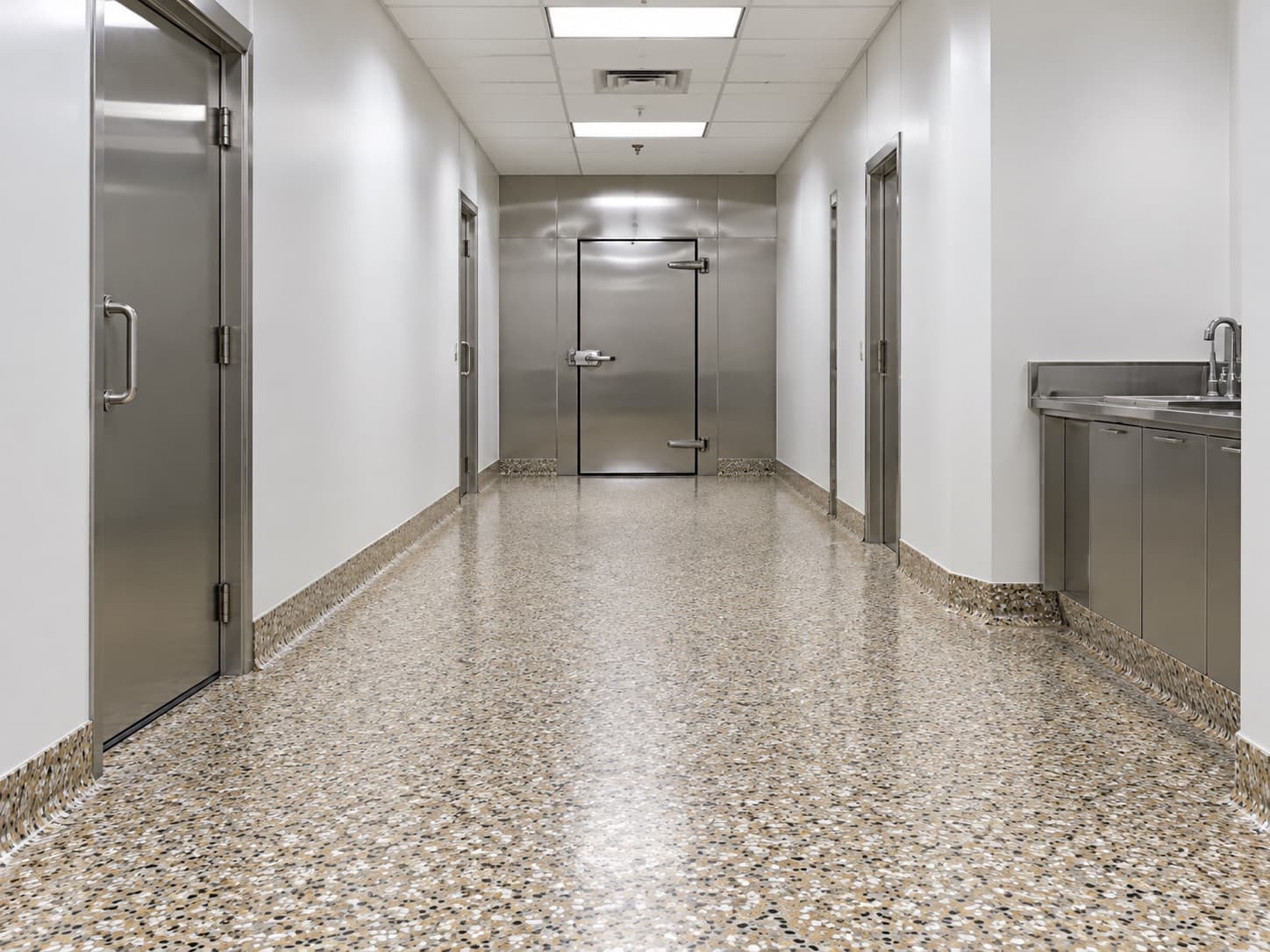 Clean hallway with a seamless floor and cove base